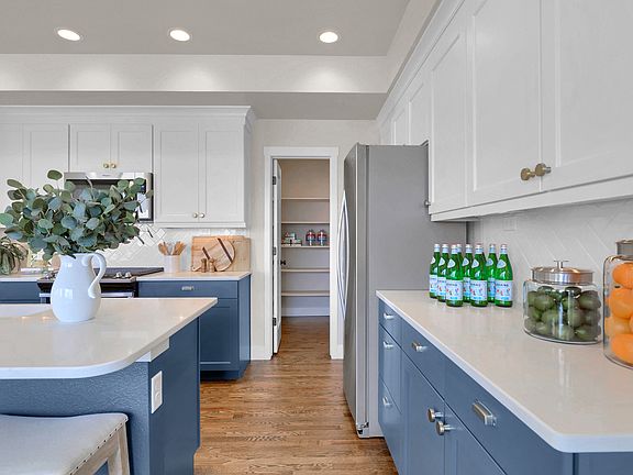 Kitchen has attached walk-in pantry. Photo representing home to be built and may demonstrate option