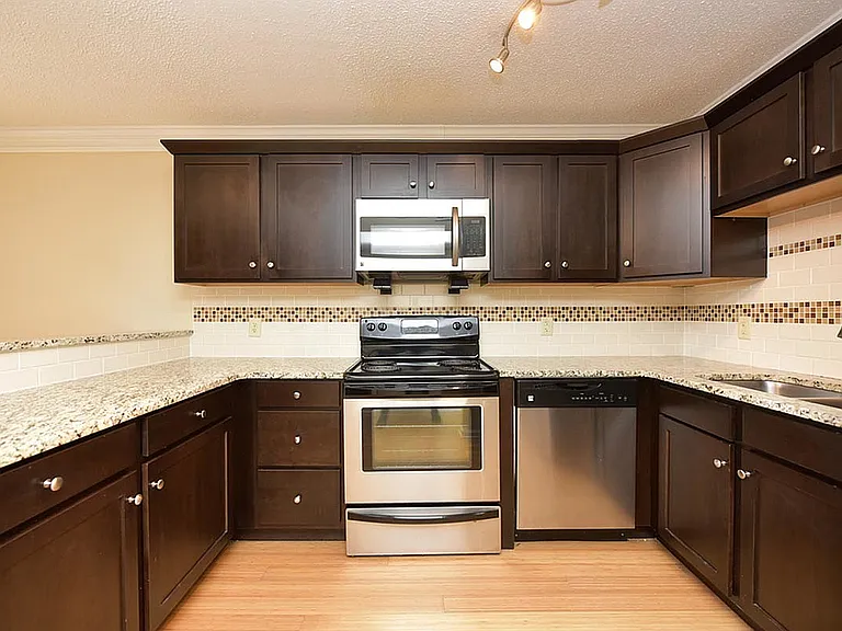 Experience culinary excellence in this sleek, modern kitchen.