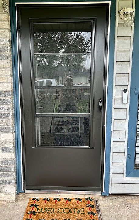 Storm screen door