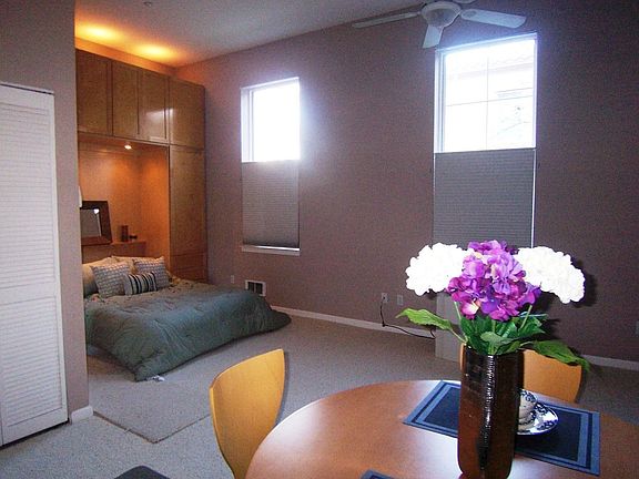 Bedroom alcove with custom wall-unit w/murphy bed, storage & accent lighting
