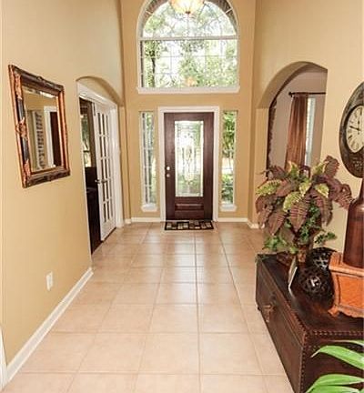 Inviting 2 story entry with tile flooring.