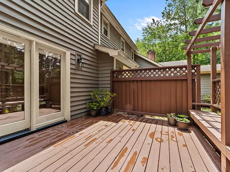 French doors open from the living room to the private rear deck for easy indoor-outdoor living.