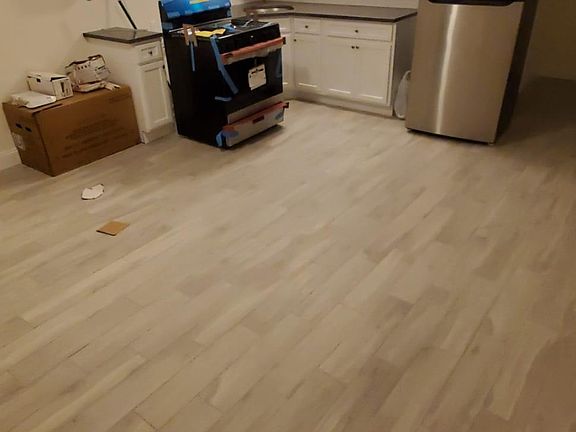 Kitchen having stainless steel appliances installed along with backsplash