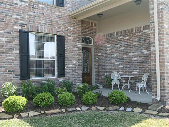Enjoy an afternoon break from this cozy front porch.