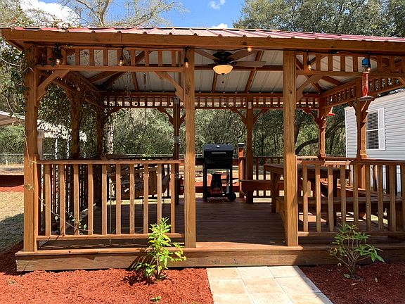 GRILL AREA, PORCH SWING & SITTING AREA