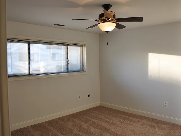 Master bedroom has his and hers double closets, ceiling fan, new carpet and a full master bathroom.