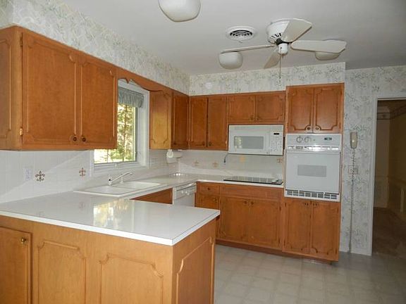 Spacious kitchen with view to the back yard.