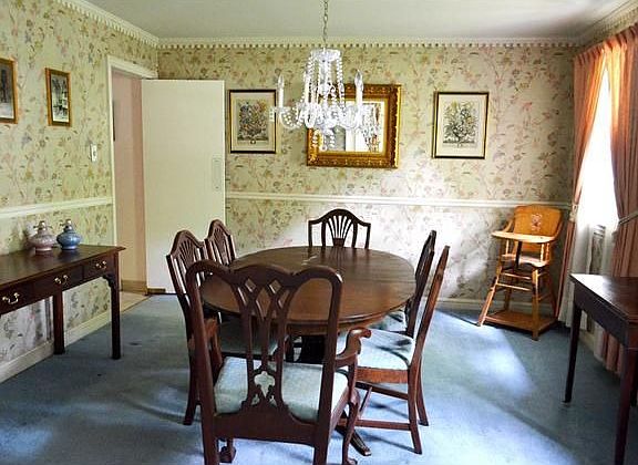 Formal dining room has chair rail molding