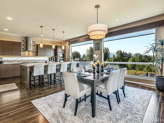 Designer lighting, expansive spaces and breathtaking views. Note the custom valance with speakers and easy pull down sun shades