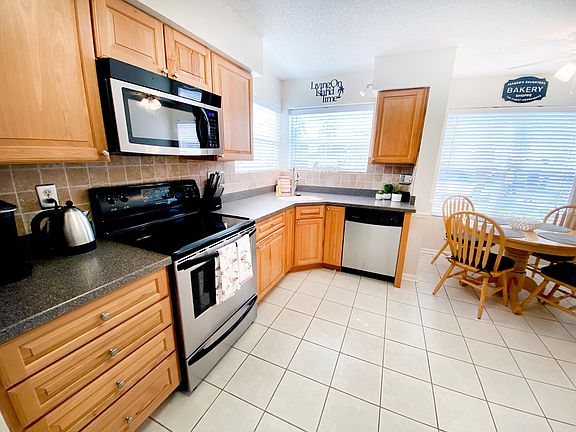 The fully-equipped kitchen has all you need to prepare a quick snack or an elaborate meal, with stainless steel range, microwave, and dishwasher.