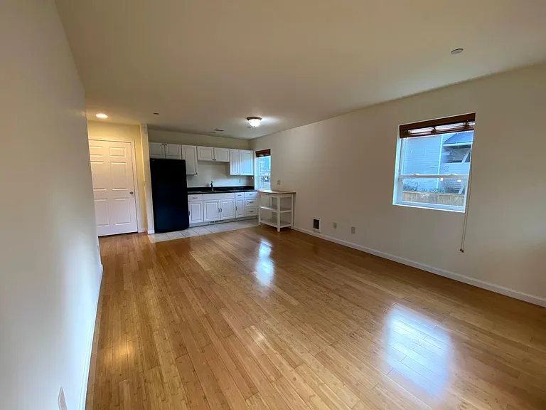 Spacious living room with an open kitchen layout