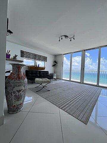 LIVING ROOM WHITE STONE FLOORS