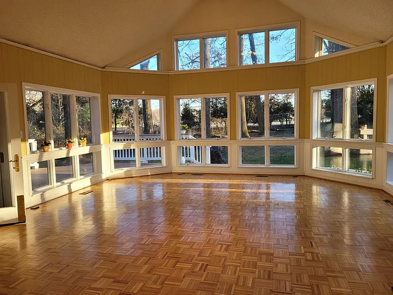 Large Sunroom with cathedral ceiling adjacent to kitchen, great for entertaining