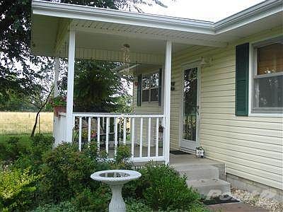 Bring the Pony!!!  Adorable Cottage with Shop! on 3 Acres!  Well maintained!!!  Close in....Nixa!!!  No restrictions on property except no mobiles!!!   So raise your own beef or chickens....
