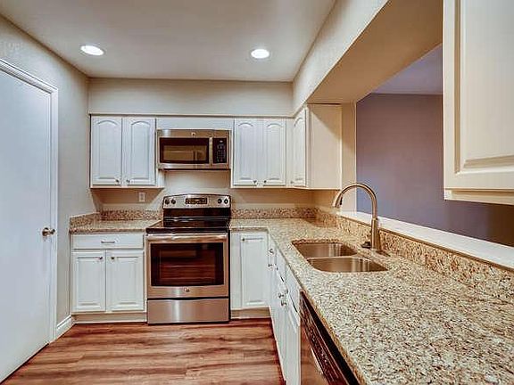 Kitchen with granite counter-tops & stainless steel appliances