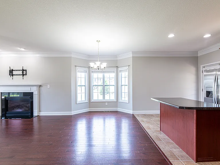 Dinning room features a bump-out extension for more natural lighting and space