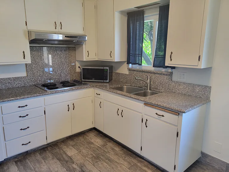 Kitchen with lots of natural light and breakfast nook.