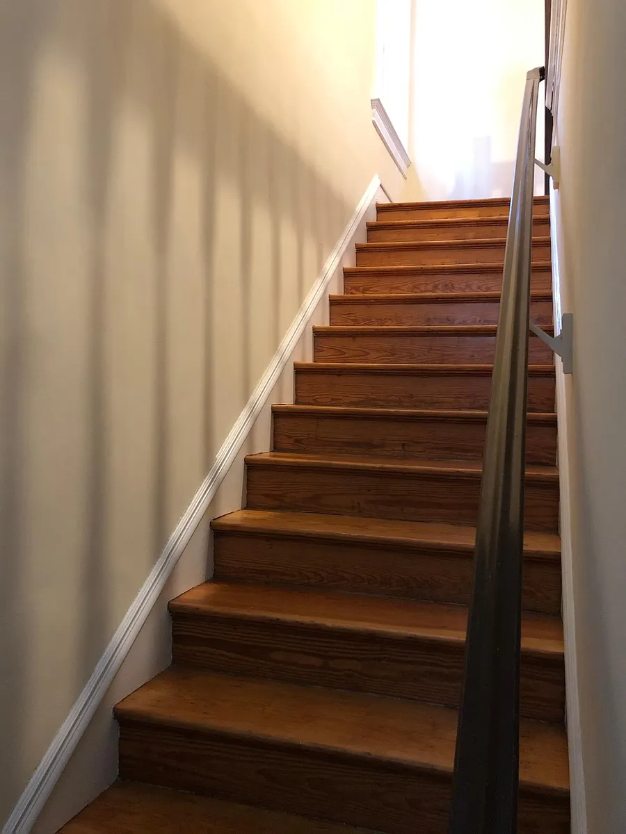 Stairs leading up to apartment. - 2502 Stuart Ave #A