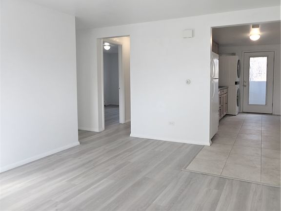 View from living room of kitchen (right) and hallway (left)