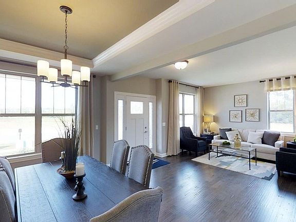 Jericho II model home dining room foyer and living room by William Ryan Homes