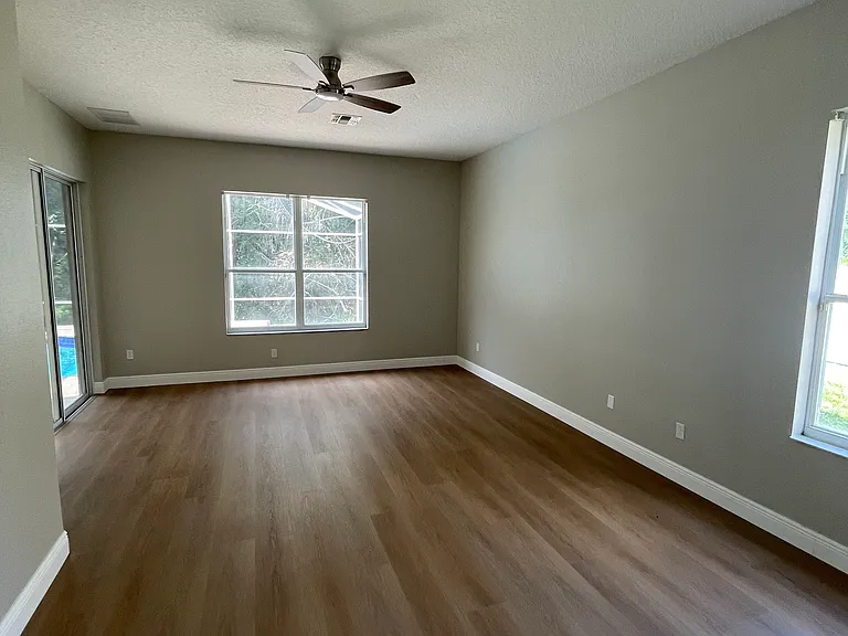 Master bedroom with slider to poo/patio