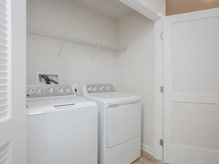 Full-sized GE washer & dryer in the hall of the second floor