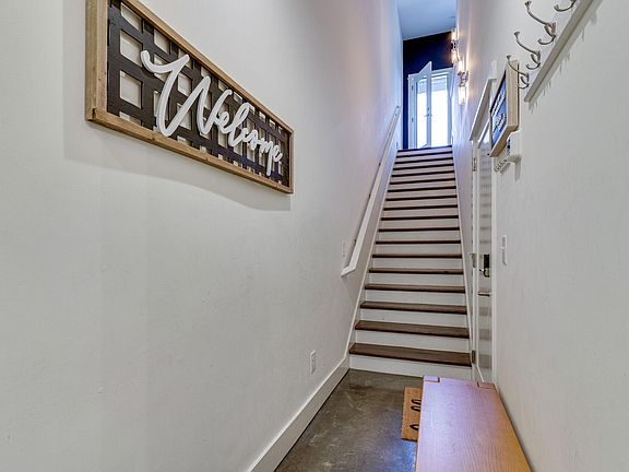 View of Entry from Garage on 1st Floor. Door at the Top of the Stairs opens to the Balcony for Morning Coffee or Evening Cocktails.