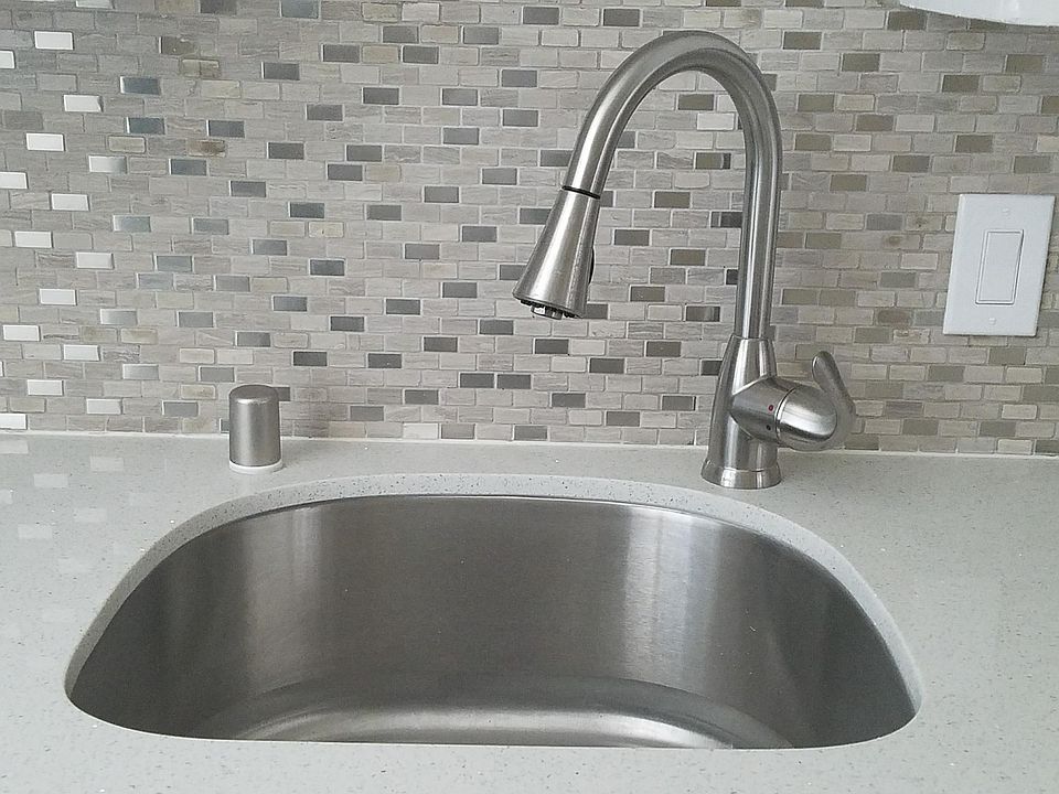SS sink with garbage disposal and full back splash