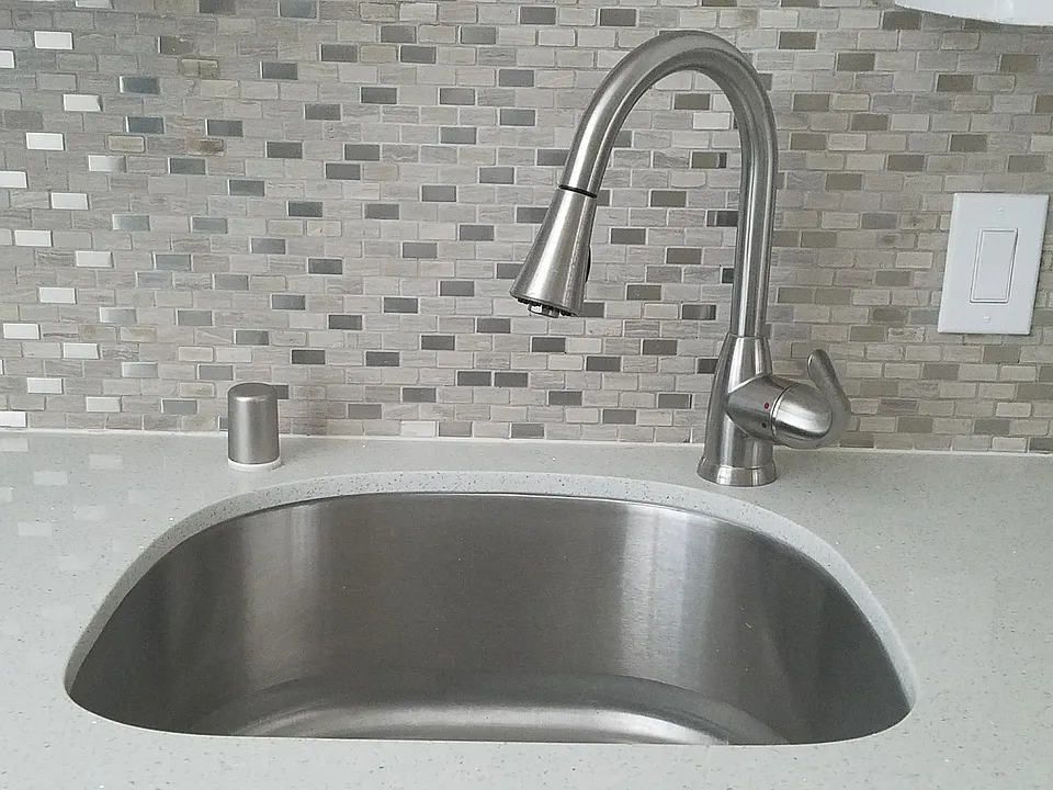 SS sink with garbage disposal and full back splash