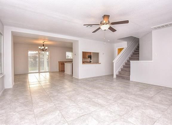 Super clean tile throughout the downstairs, big windows, classy new front door with a secure storm d
