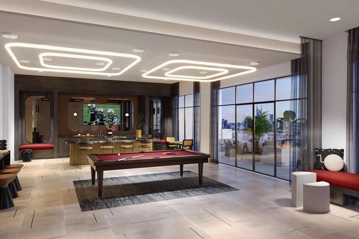 Rooftop lounge with demonstration kitchen, outdoor terrace with firepit, and sweeping views of Downtown Nashville.