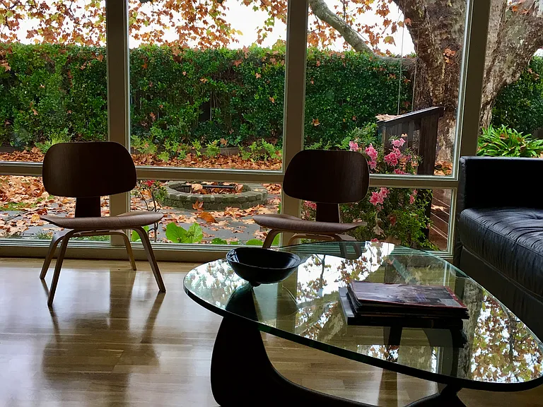Family Room with large panel windows overlooking the backyard