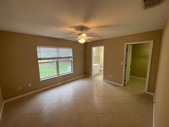 Master suite, private bath with tub shower, vanity and toilet