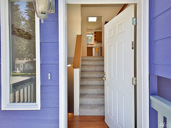 Welcome! Upstairs you will delight in living/dining/kitchen with vaulted ceilings and lots of windows in addition to three rooms that can live as bedrooms & a full bath.  Downstairs, huge great room & full bath with laundry & access to garage. 