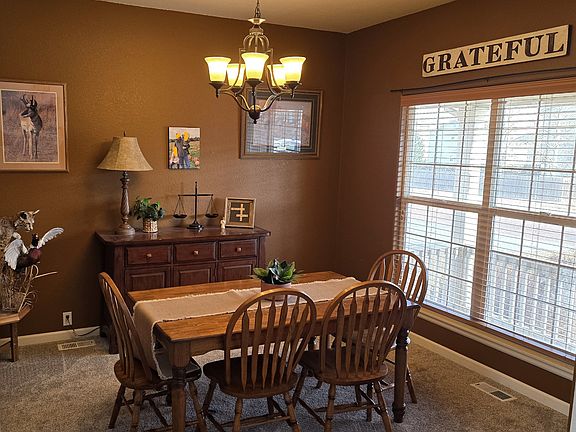 Dining room or Sitting room. Front door is to the right, kitchen is left or through dining room to left.