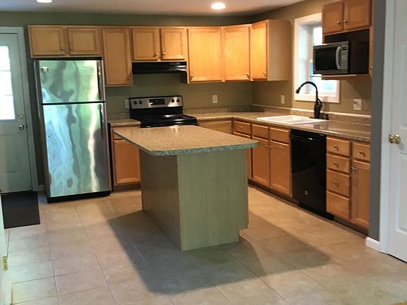 kitchen with stainless steel appliances and tiled floor