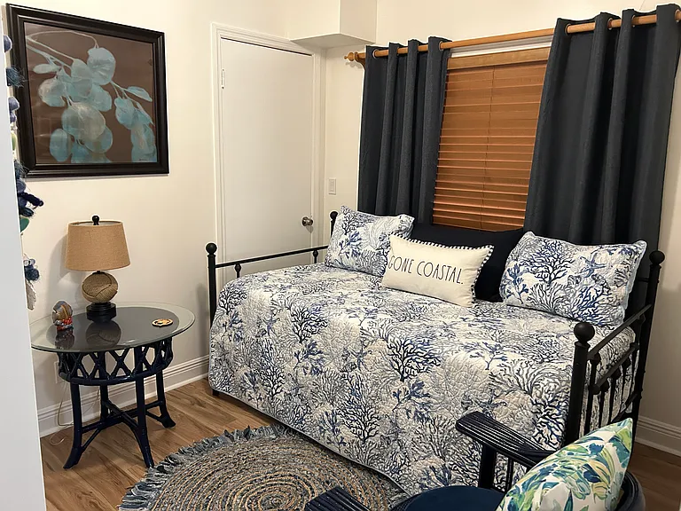 Guest bedroom with twin bed closet table & chair