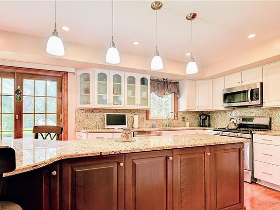 Cherry Cabinets compliment the large Center Island with Granite Counter tops.