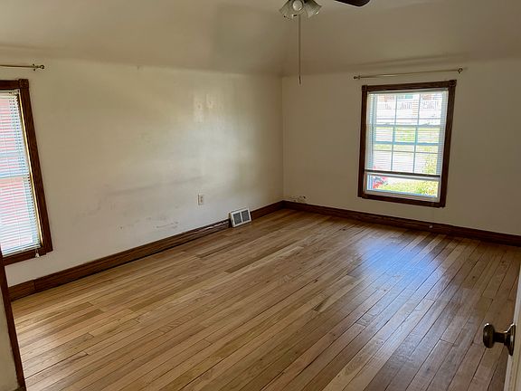 Master bedroom with freshly restored hardwood