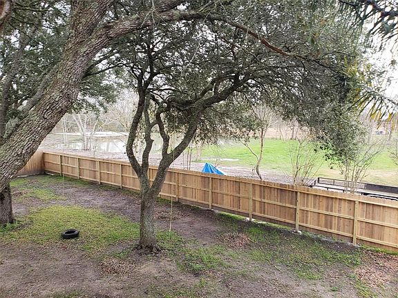 View of pond from second floor deck of home.