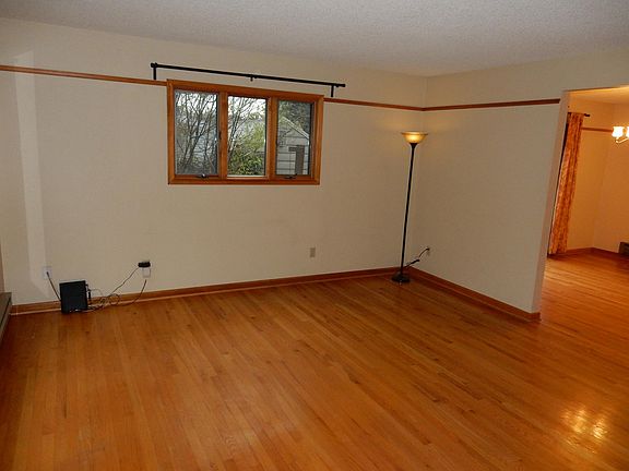 Spacious living room with hardwood floors.