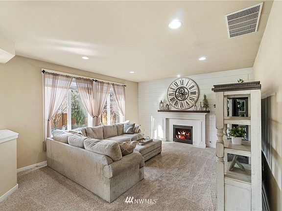 ~Spacious living room with cozy gas fireplace~