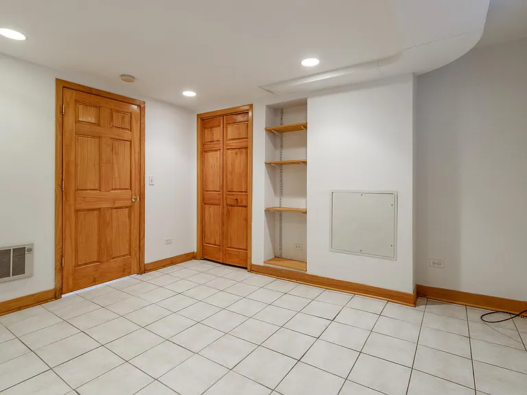 2nd Bedroom, Guest Room, Office or exercise room OR Media Room. Bedroom door to the left and closet door to the right of the bedroom door are solid wood doors as is the trim. Lots of recessed lighting. Large enough for a king-sized or queen sized bed.