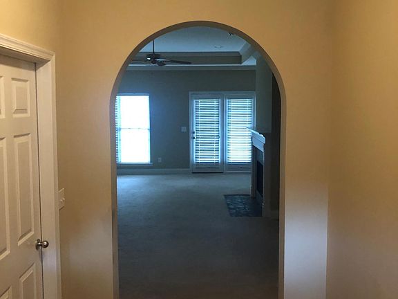 View of den and front hall from front door