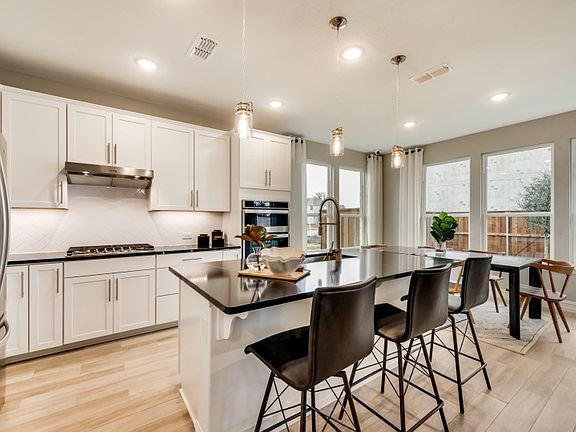 Spacious kitchen with view of dining area