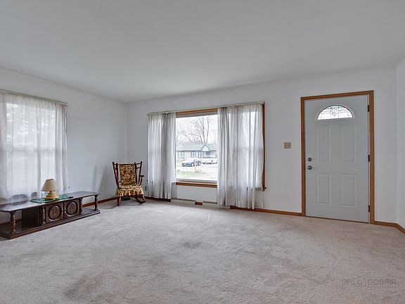 Spacious Living room with lots of natural light.  Just painted!