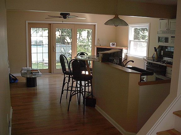 VIEW INTO KITCHEN W/BREAKFAST BAR