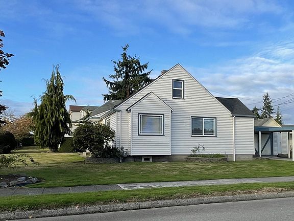 South side - shows garage, carport and storage