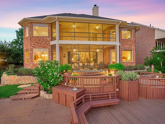This 2 story home features an abundance of deck space, screened-in balcony & screened-in porch with amazing lake views.