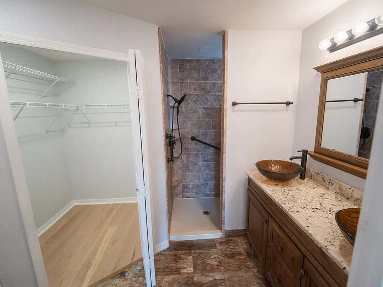 Upgraded walk in shower and walk in closet in the owners suite.